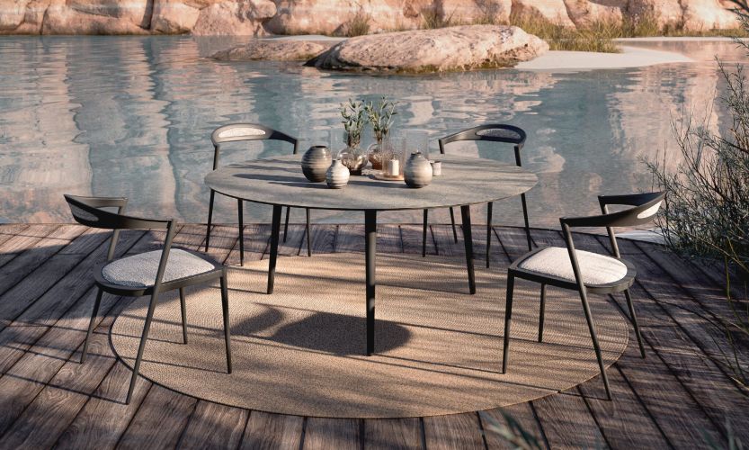 STYLETTO-160R-ROUND-TABLE-STYLETTO-55-DINING-CHAIRS-RUG-240-2048x1229